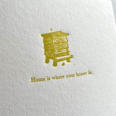 Greeting card letterpress printed with vintage beehive illustration and the words Home is where your honey is