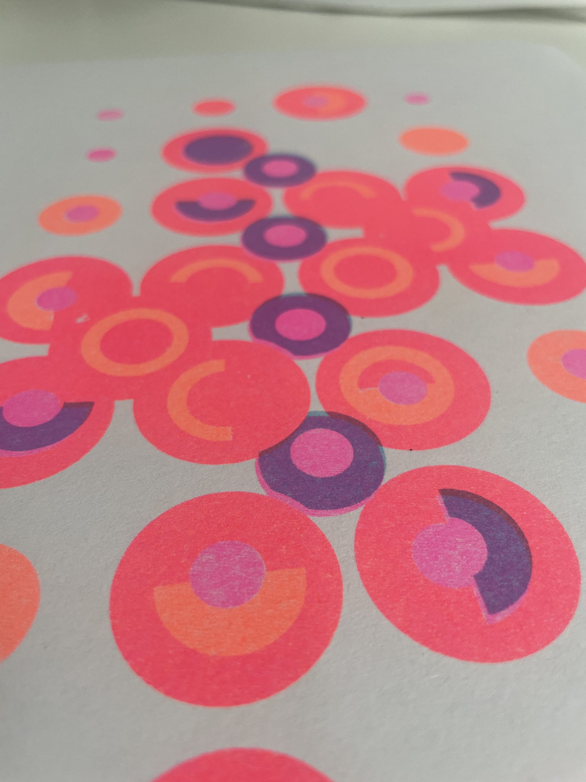 Close up image of a risograph printed abstract design on uncoated paper